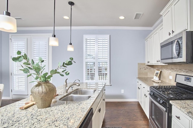 590 Grand Central Sta, Apex, NC 27502 - kitchen featuring stainless steel appliances, crown molding, backsplash, white cabinets, and light stone countertops