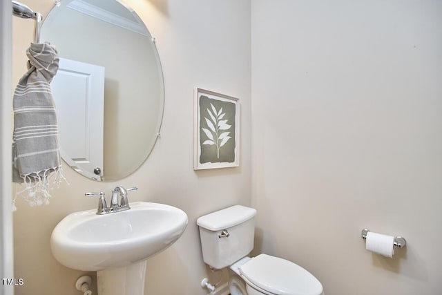 590 Grand Central Sta, Apex, NC 27502 - half bathroom featuring toilet and ornamental molding