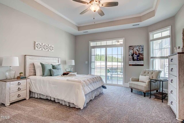142 Oban Dr, Home, Sanford, NC 27330 - bedroom featuring light colored carpet, visible vents, access to exterior, and multiple windows