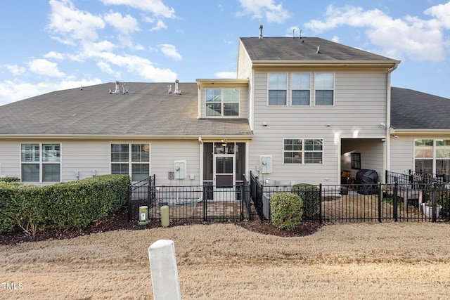 rear view of property with fence and a patio