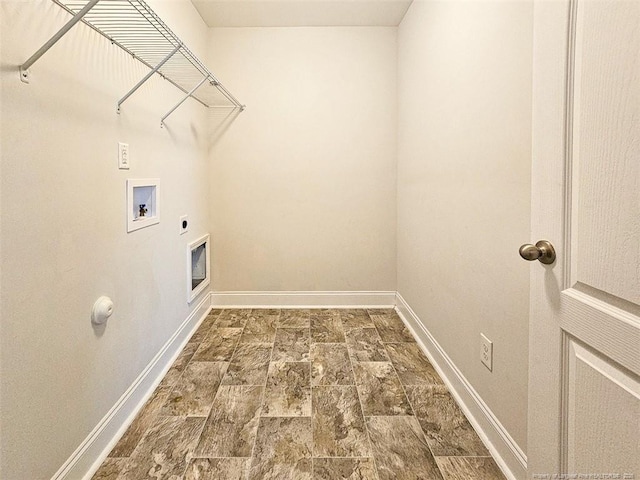 laundry room with washer hookup, stone finish flooring, electric dryer hookup, laundry area, and baseboards