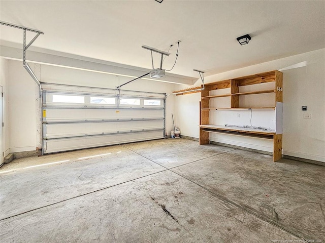 garage featuring a garage door opener and baseboards