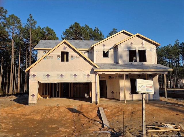 property in mid-construction with a garage