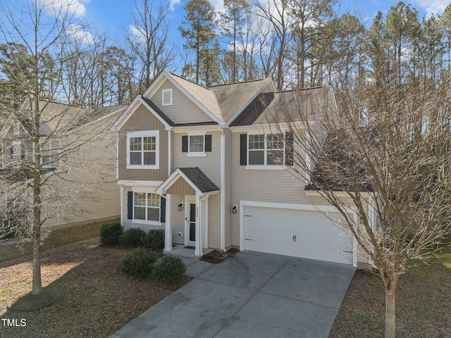 view of front of property with a garage and concrete driveway