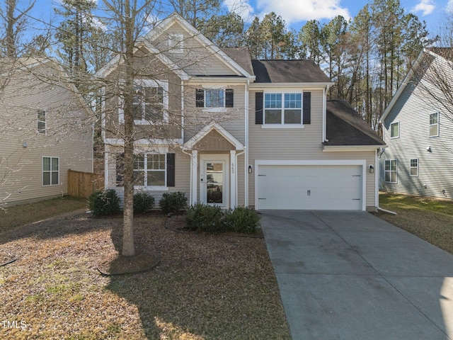 view of front of property featuring concrete driveway