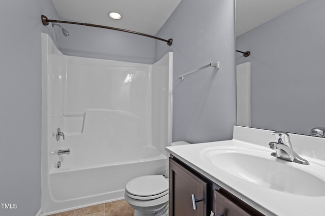 full bath featuring bathtub / shower combination, tile patterned flooring, toilet, recessed lighting, and vanity