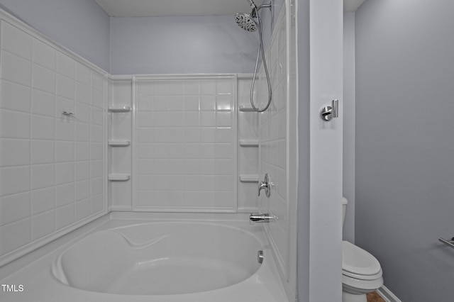 bathroom featuring toilet and  shower combination