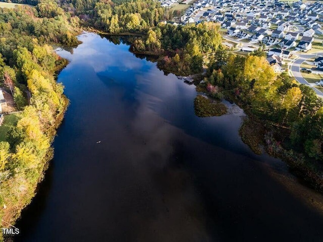 drone / aerial view featuring a water view and a residential view