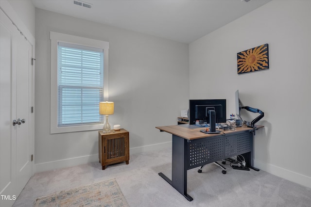 office area with light carpet, visible vents, and baseboards