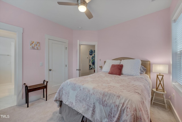 bedroom with baseboards, a ceiling fan, and light colored carpet