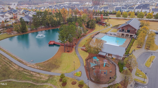 birds eye view of property with a residential view and a water view