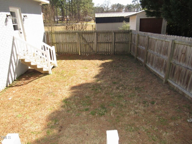 view of yard with a fenced backyard