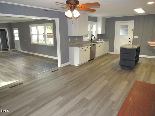 136 Dogwood Trl, Wendell, NC 27591 - kitchen featuring stainless steel dishwasher, a sink, white cabinets, a ceiling fan, and open shelves