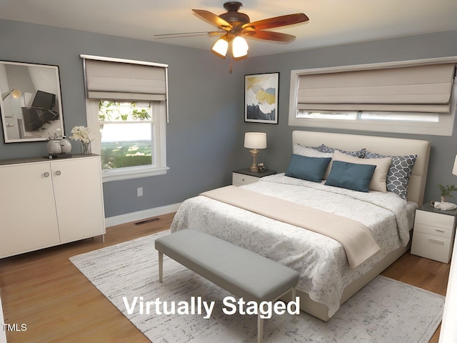 136 Dogwood Trl, Wendell, NC 27591 - bedroom featuring wood finished floors, baseboards, and ceiling fan