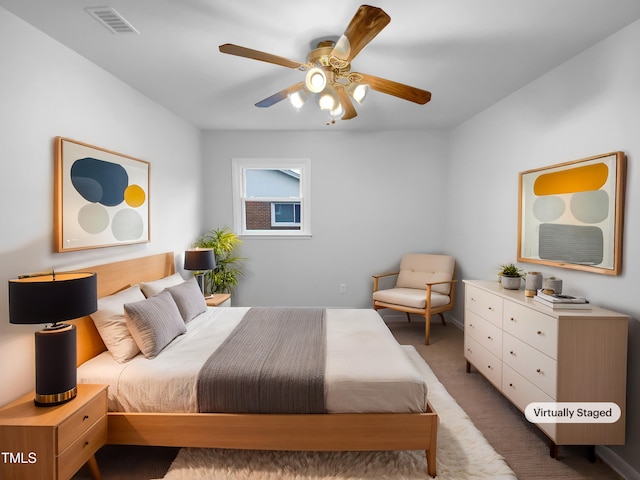 bedroom featuring carpet, visible vents, and a ceiling fan