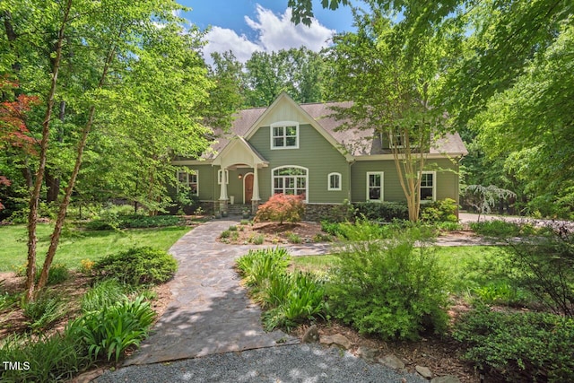 craftsman-style home featuring a shingled roof