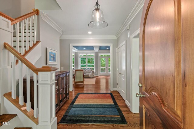 entrance foyer featuring dark wood-style floors, crown molding, stairway, and recessed lighting