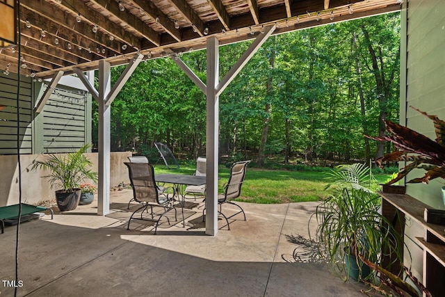 view of patio featuring outdoor dining area