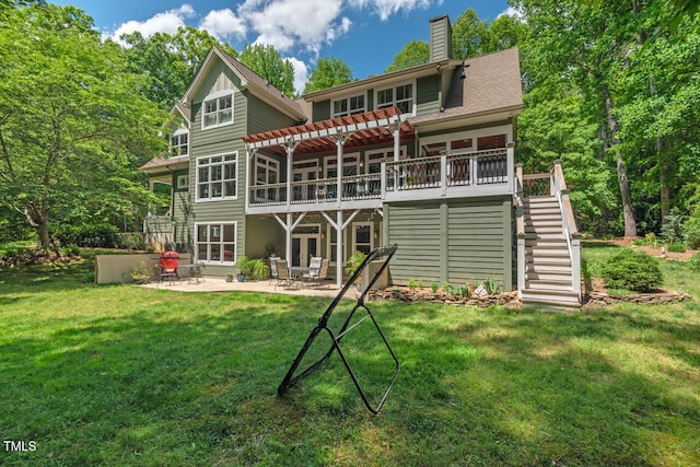 back of house with stairs, a patio, a deck, and a yard