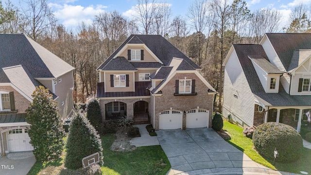 view of front of home featuring driveway, a shingled roof, an attached garage, a porch, and brick siding