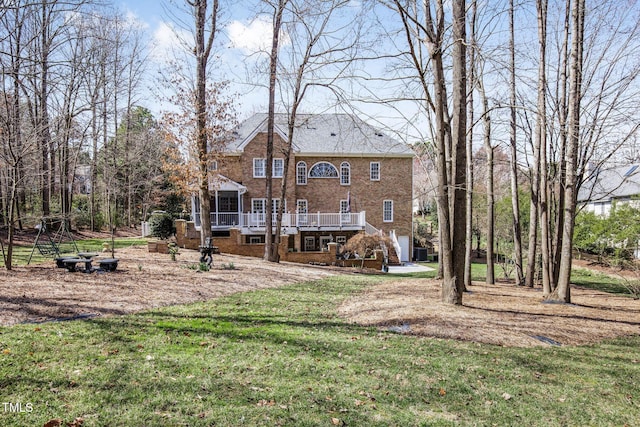 view of yard featuring stairway, a deck, and an attached garage