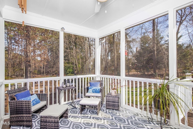 unfurnished sunroom with a healthy amount of sunlight and ceiling fan