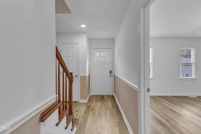 410 Oak Run Dr, Raleigh, NC 27606 - entrance foyer featuring light wood-style flooring and stairs