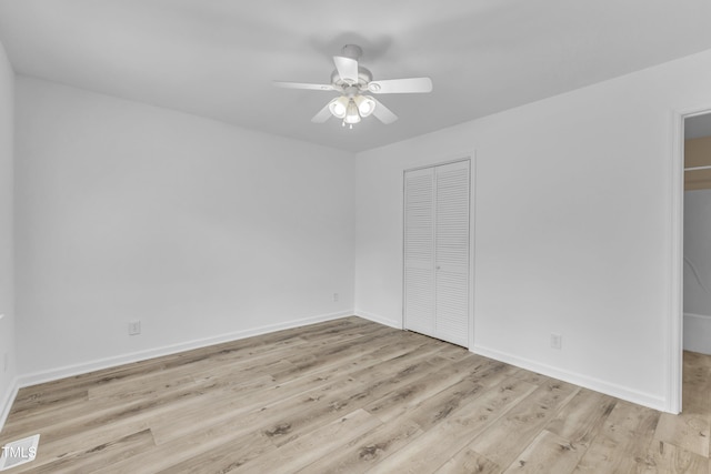410 Oak Run Dr, Raleigh, NC 27606 - unfurnished bedroom featuring wood finished floors, a ceiling fan, and a closet