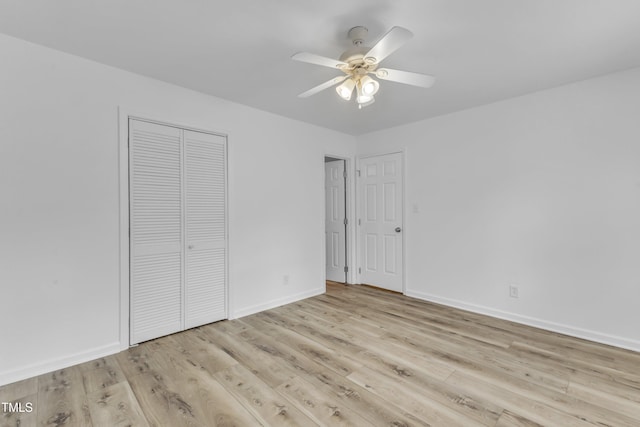 410 Oak Run Dr, Raleigh, NC 27606 - unfurnished bedroom featuring wood finished floors, a closet, and a ceiling fan