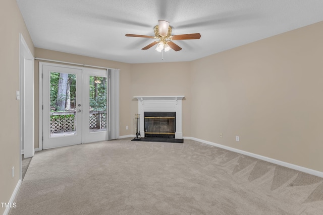 410 Oak Run Dr, Raleigh, NC 27606 - unfurnished living room featuring a ceiling fan, carpet, and a fireplace with flush hearth