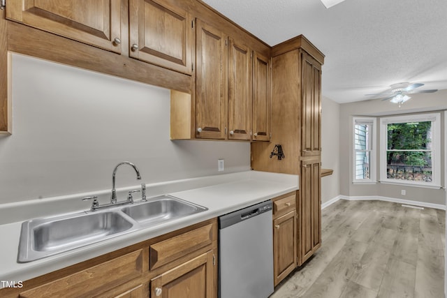 410 Oak Run Dr, Raleigh, NC 27606 - kitchen with dishwasher, light countertops, brown cabinets, light wood-style flooring, and ceiling fan