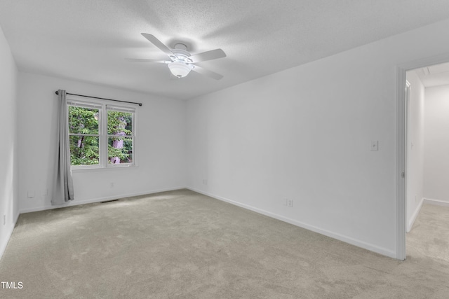 410 Oak Run Dr, Raleigh, NC 27606 - carpeted empty room with ceiling fan, attic access, and a textured ceiling