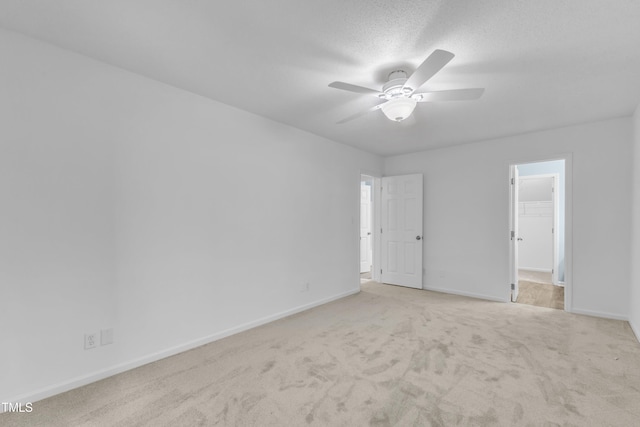 410 Oak Run Dr, Raleigh, NC 27606 - unfurnished bedroom with carpet floors, a walk in closet, and a ceiling fan