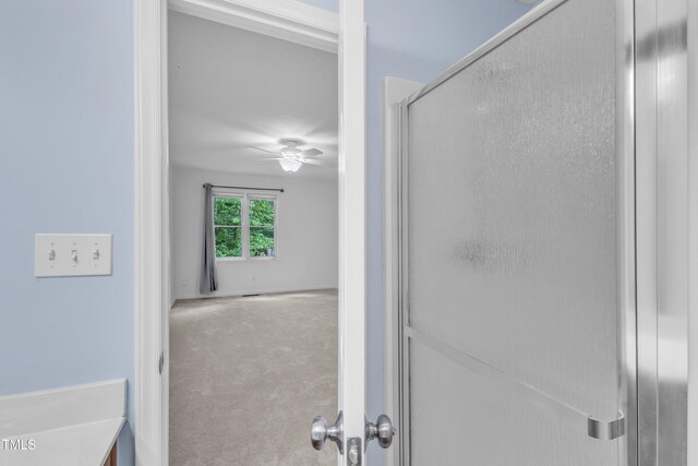 410 Oak Run Dr, Raleigh, NC 27606 - full bath featuring ceiling fan and a shower with door