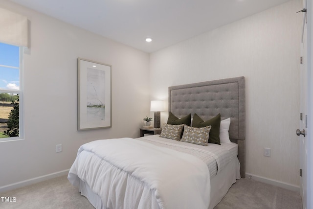 bedroom featuring light carpet, baseboards, and recessed lighting