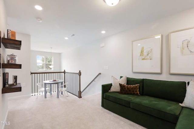 carpeted living area featuring recessed lighting and visible vents