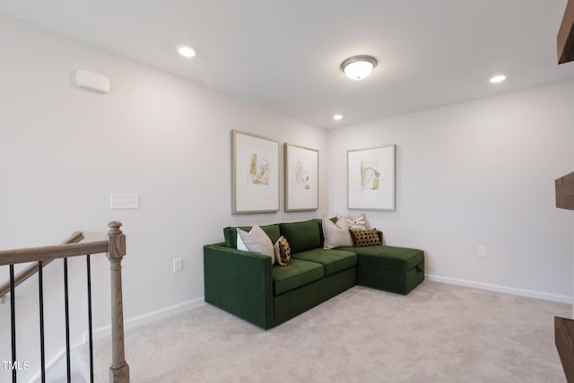 carpeted living room with recessed lighting and baseboards