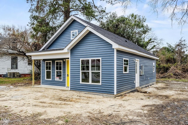 rear view of house featuring cooling unit