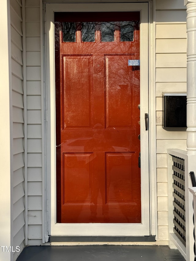 property entrance with a garage