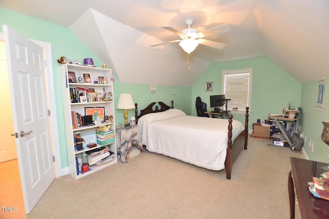 bedroom featuring vaulted ceiling, a ceiling fan, and light colored carpet