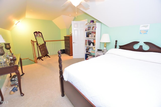 bedroom featuring vaulted ceiling, a ceiling fan, and light colored carpet