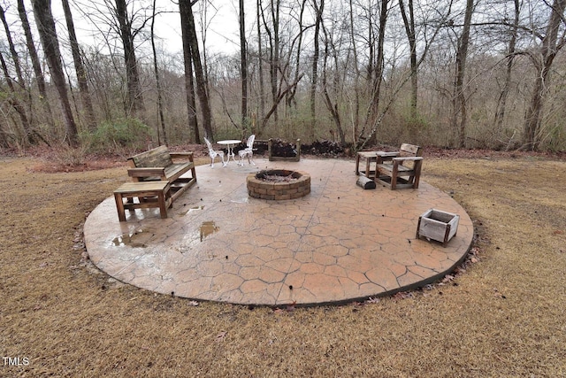 view of patio featuring an outdoor fire pit