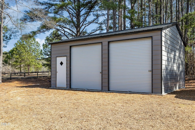 view of outdoor structure featuring an outdoor structure and fence