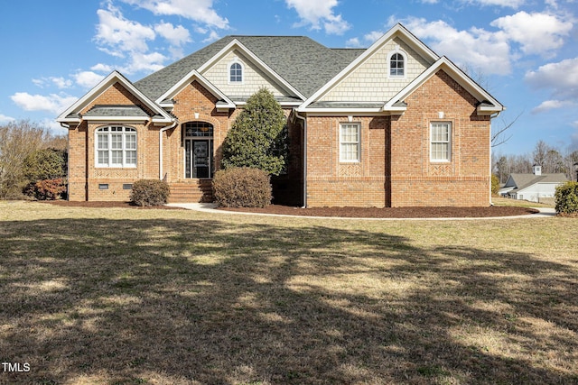 view of front of property featuring crawl space, brick siding, and a front lawn