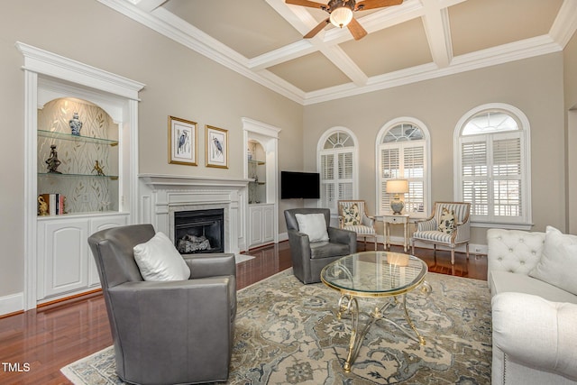 living room with a fireplace with flush hearth, coffered ceiling, beamed ceiling, and wood finished floors