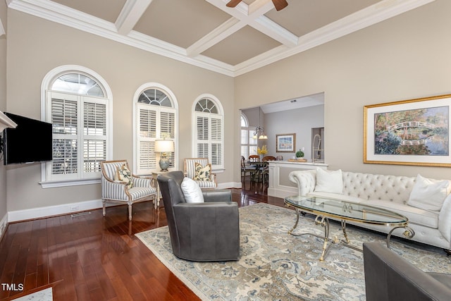 living room featuring hardwood / wood-style flooring, baseboards, coffered ceiling, and beam ceiling