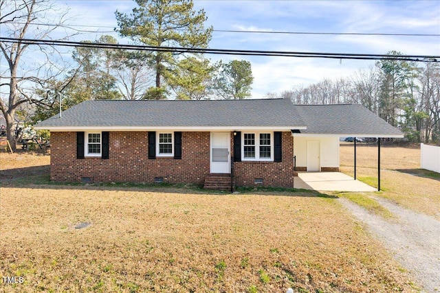 ranch-style home with entry steps, driveway, crawl space, a front lawn, and brick siding