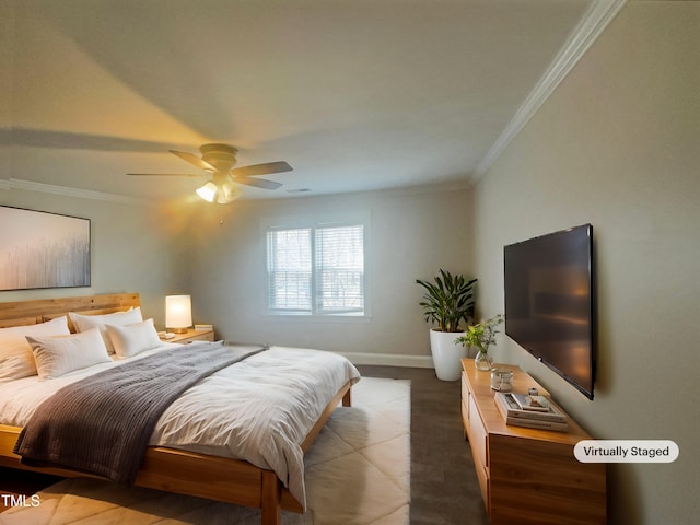 bedroom featuring a ceiling fan, crown molding, and baseboards