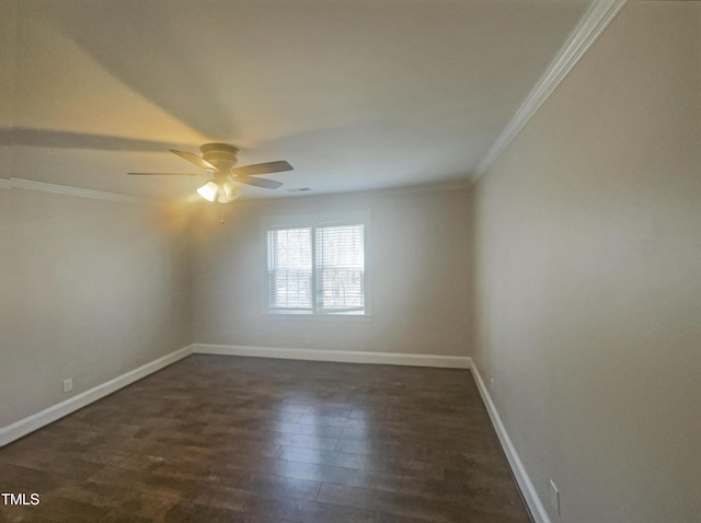 spare room with a ceiling fan, baseboards, ornamental molding, and dark wood-type flooring