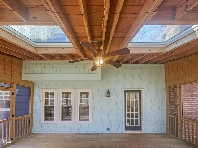 wooden deck with a ceiling fan